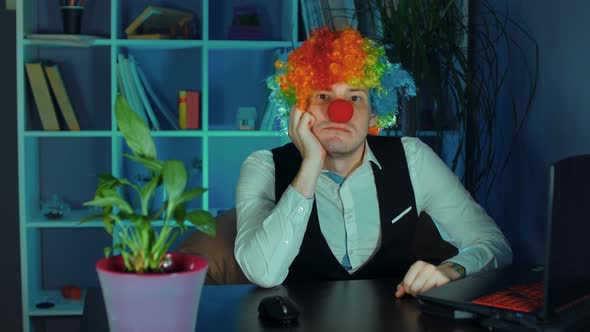 Young Man in Image of Clown Makes Squint Looking at Camera alt