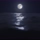 Beautiful Clear Moon Reflecting In The Ocean Or Sea Night Sky With Stars Loop 4k