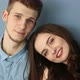 Young Couple in Love Sitting at Home By the Blue Wall - VideoHive Item for Sale