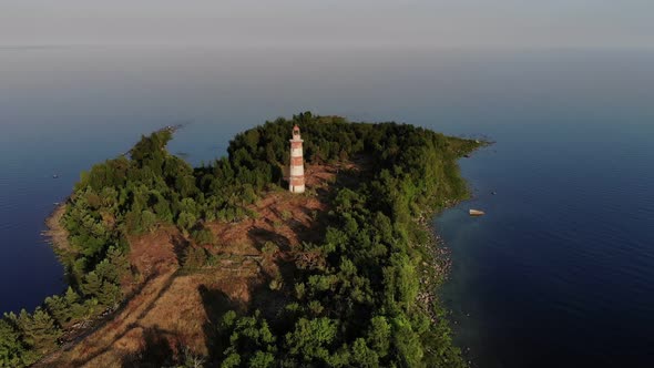 Old lighthouse at small Heinaluoto island of Ladoga lake, aerial shot alt