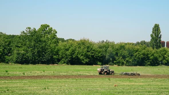 Tractor Cultivating Field alt