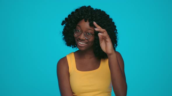 Happy African Woman Smiling and Looking at Camera alt