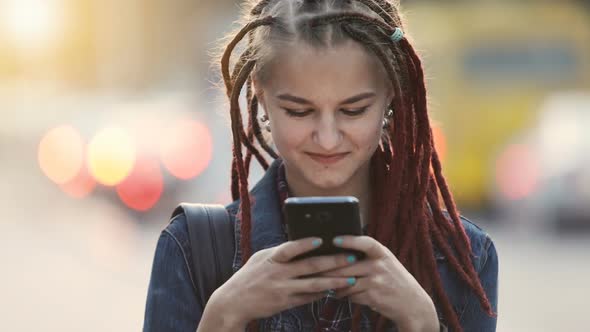 Girl Texts in Street