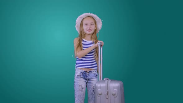 Traveling Girl with Suitcase, Passport and Ticket Isolated on Green Background alt