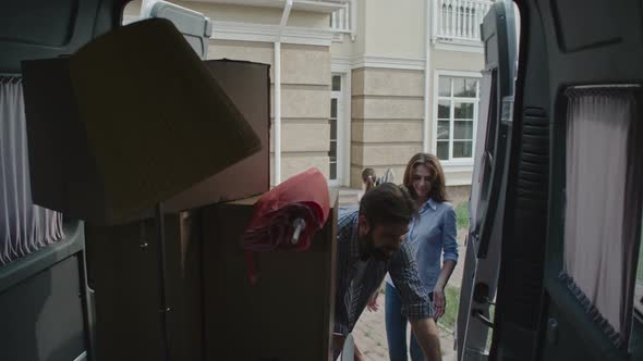 Young Family Moving in New Place alt