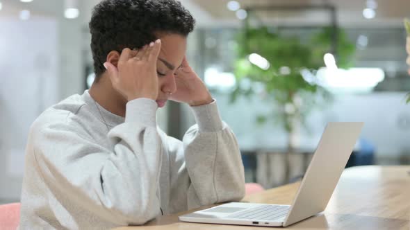 Casual African Woman with Laptop Having Headache  alt