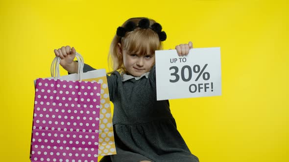 Child Girl Showing Up To 30 Percent Off Inscription Sign and Shopping Bags. Teen Pupil Smiling alt