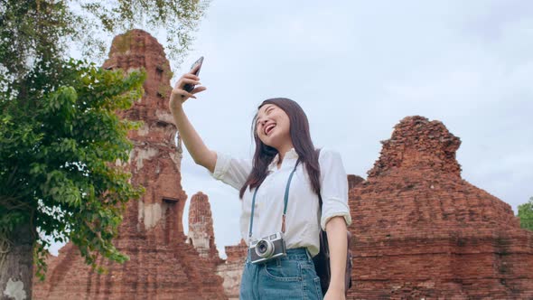 blogger woman casual take selfie video call on mobile phone sharing live online for audience travel.