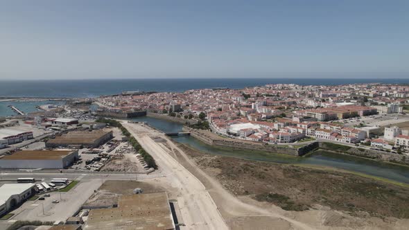 Peniche peninsula, Portugal. Skyline sprawling city against Atlantic ocean. Aerial view