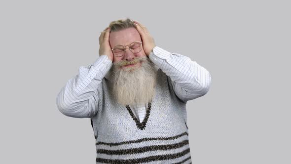 Elder Man with Terrible Head Pain Touching Head with Both Hands alt