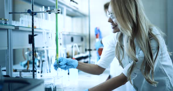 Female Student of Chemistry Working in Laboratory
