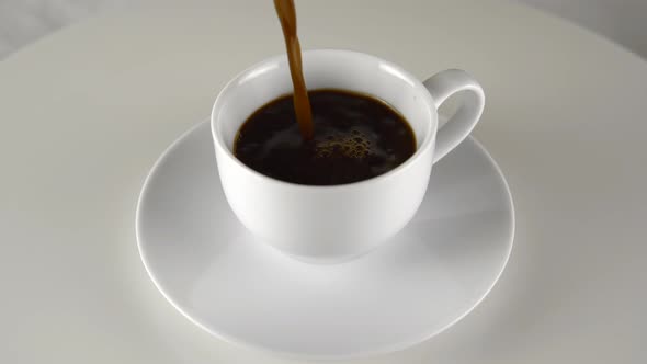 Pore Coffee Without Milk in Espresso Cup