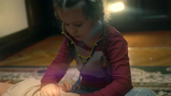 Cute Little Sisters Playing Together alt