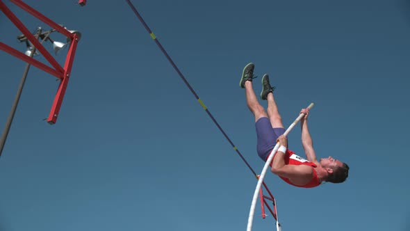 Track athlete doing pole vault in super slow motion, shot on Phantom Flex 4K