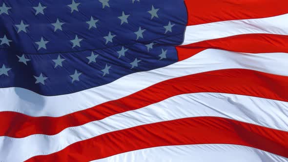 American Flag Flying in the Wind at Sunny Day alt