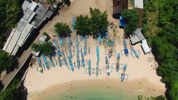Jukung, wooden fishing boats on sand aerial close up, Gesing Beach, Yogyakarta alt