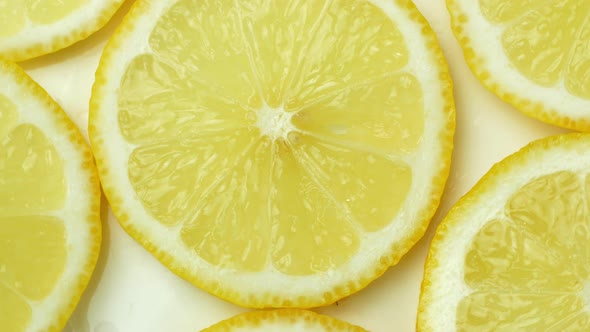 Rotation of a juicy yellow lemon. Top view, 360 degree rotation, close-up of a lemon in a cut.
