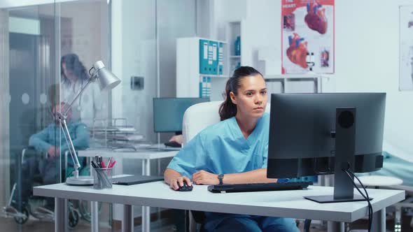 Nurse Working on PC alt