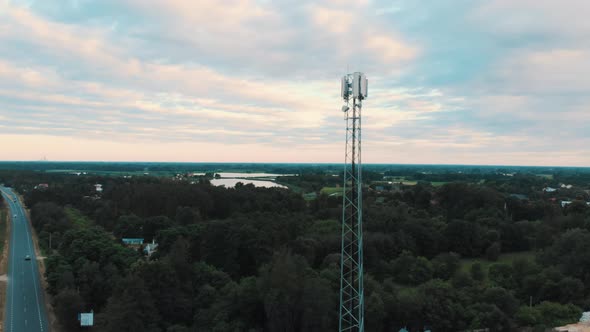 Tower with 5g Antennas in Countryside. Telecommunication Concept. Parallax Shot alt