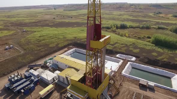Equipment of Oil Well in Field, Top View From Drone