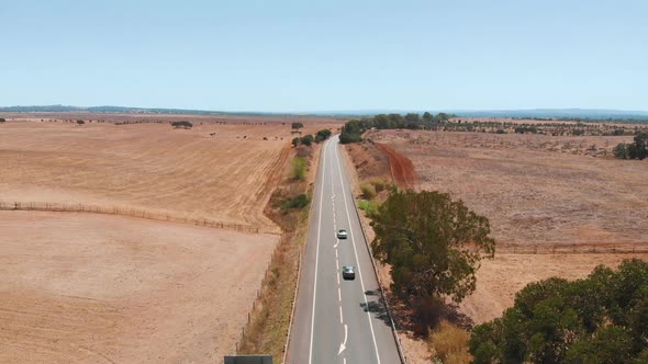 Cars Drive on a Deserted Road, Aerial View Shot.