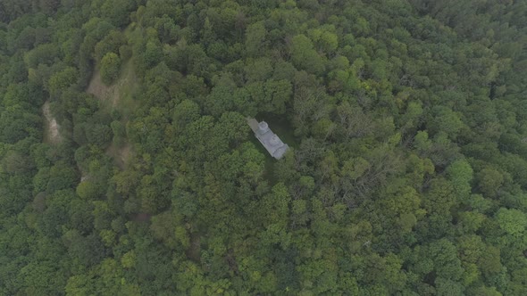 Aerial shot of a church on a hill alt