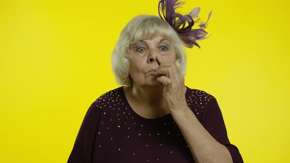 Funny Stupid Senior Old Woman Picking Nose with Silly Expression, Removing Boogers, Bad Manners alt