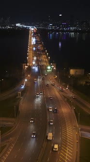 Night City Traffic on the Bridge aerial vertical view alt