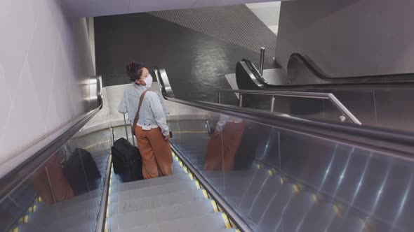 Mixed race woman wearing medical coronavirus mask alt