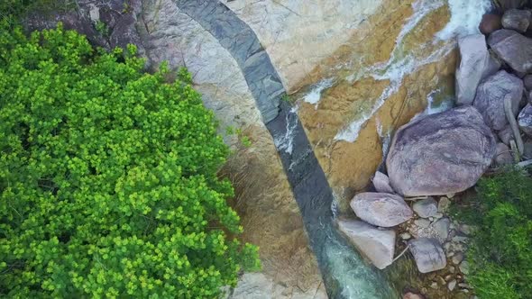 Drone Flies Over Amazing Crossing Streams on Mountain Side alt