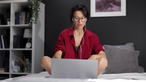 Woman Using Laptop for Studying