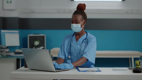Portrait of Medical Assistant with Uniform and Face Mask alt