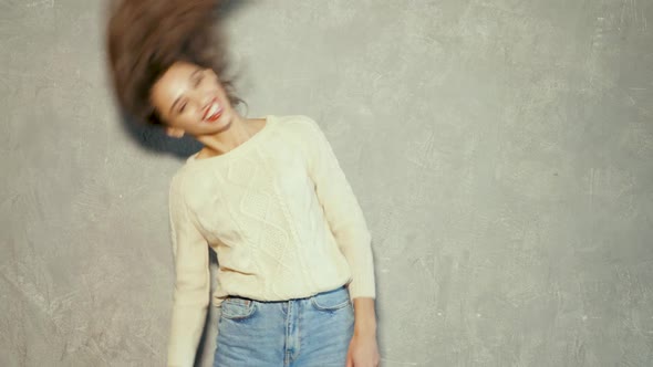 Young beautiful woman looking at camera. Trendy female in casual summer jeans clothes alt