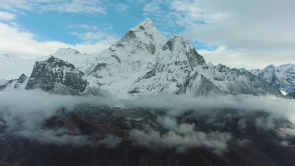 Man on Summit of Nangartsang Looking on Ama Dablam Mountain. Himalaya, Nepal. Aerial View alt