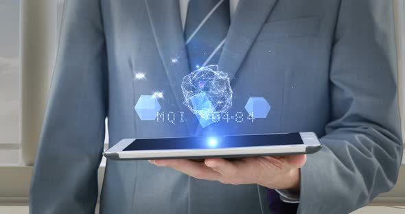 Mid section of businessman using digital tablet alt