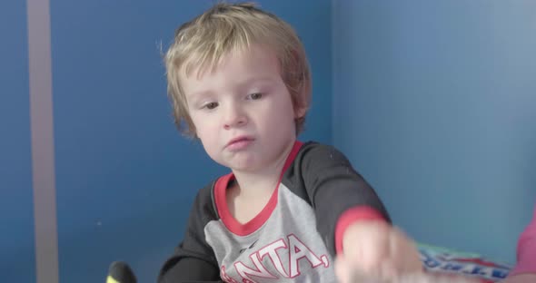 Kid being put to bed. alt