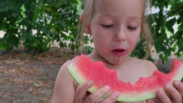 Close Up in Summertime Little Girl Eating Appetite Tasty Watermelon
