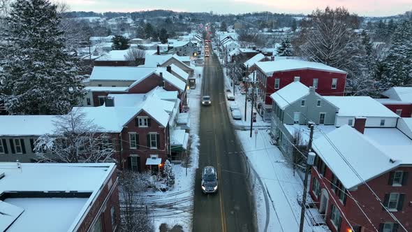 Christmas snow. Rooftop view during snow flurries. Aerial above street. Santa about to enter rooftop alt