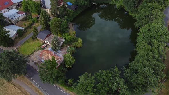 Own Carp fish farm in a lake on the doorstep.Gorgeous aerial view flight panorama curve flight dron alt