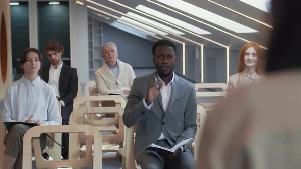 Journalists Asking Speaker Questions during News Conference alt
