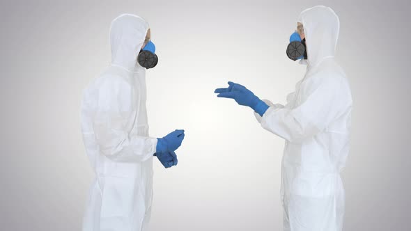 Two Doctors Giving High Five After a Successful Talk on Gradient Background. alt