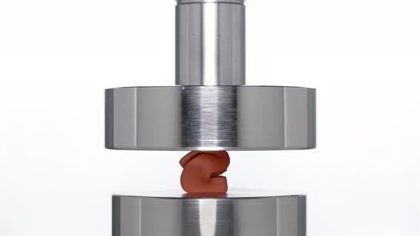 the Appearance of the Number Two When Lifting the Rod From a Hydraulic Press on a White Background alt