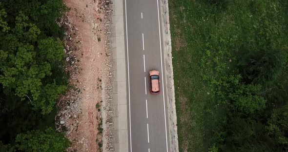 Drone Point of View Tracking Mode Aerial View Flying Over Two Lane Countryside Forest Road with alt