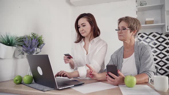 Elderly and Mature Lady Making Online Shopping at House