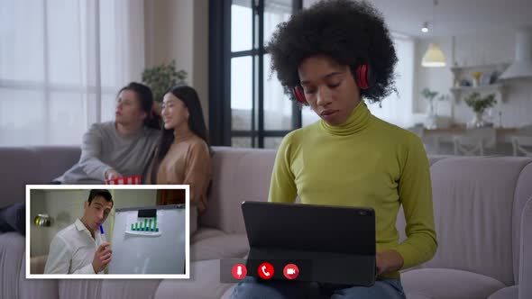 Young Busy African American Woman Using Tablet As Middle Eastern Man Talking in Web Conference alt