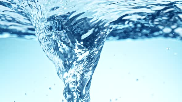 Super Slow Motion Shot of Water Whirl on Light Blue Gradient Background at 1000Fps alt