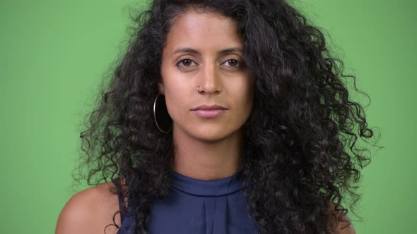 Young Beautiful Hispanic Businesswoman with Curly Hair alt
