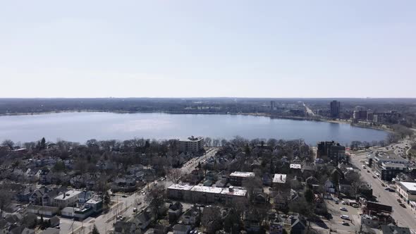 push in drone aerial shot of a lake in the spring time in minnesota alt