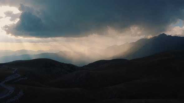 Aerial View of sunset mountain in Abruzzo, with amazing light in sunset with clouds, Italy 4K