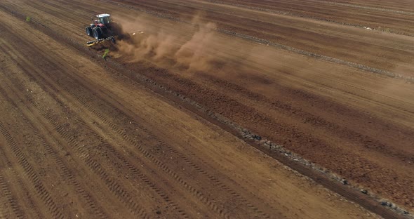 Peat Harvesting Tractor Working in Bog Field Aerial Drone Shot alt
